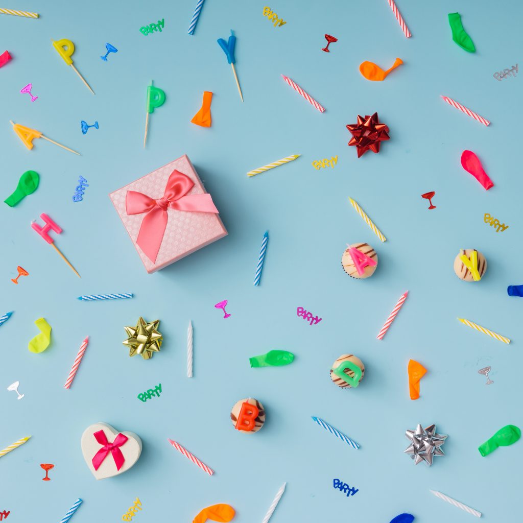 Pattern made of birthday party things. Flat lay.